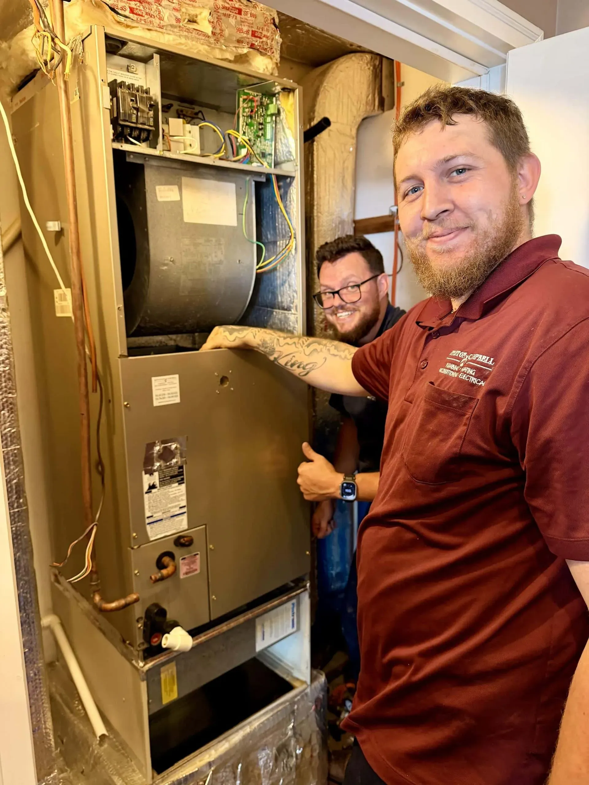 appleton campbell techs with new hvac unit