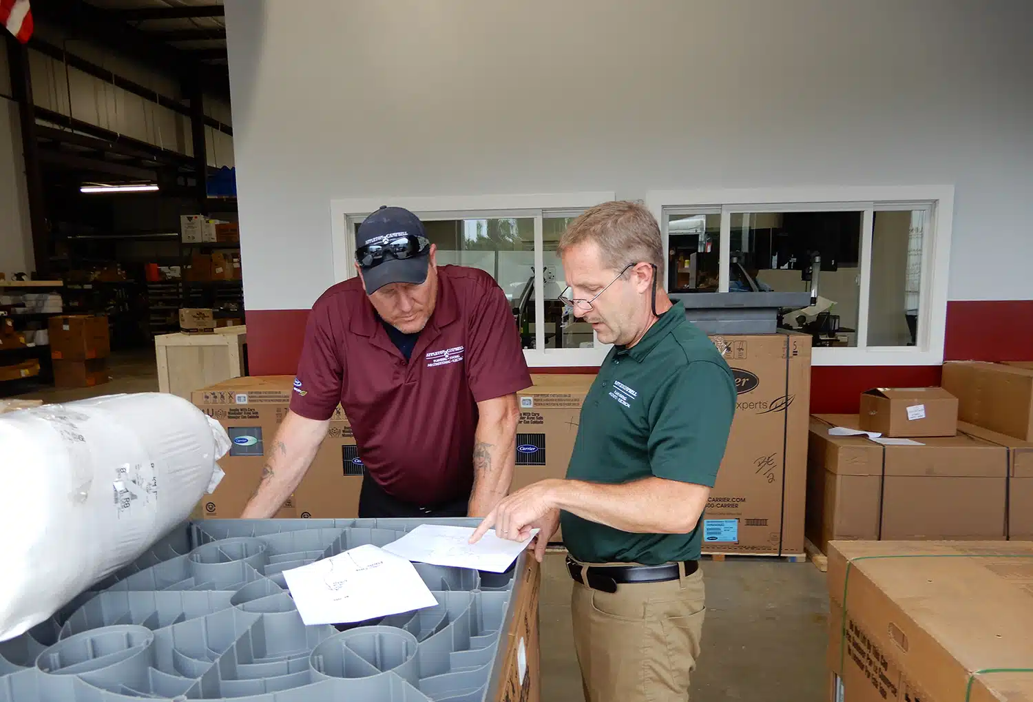 Team discussing job in warehouse in Warrenton, VA.