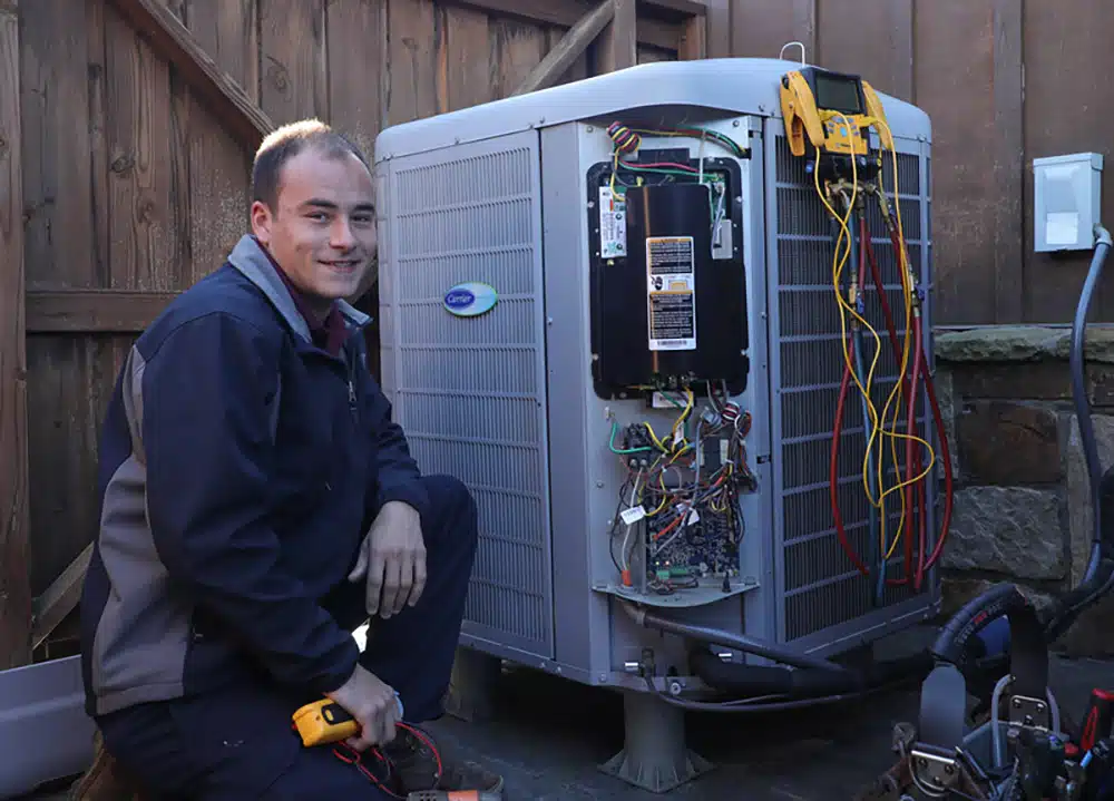 Electrician servicing AC unit in Warrenton, VA.