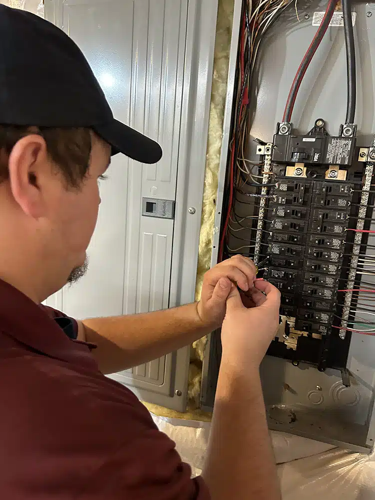 Technician working on electrical panel in Warrenton, VA.