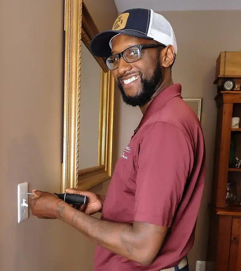 Technician installing light switch in Warrenton, VA.