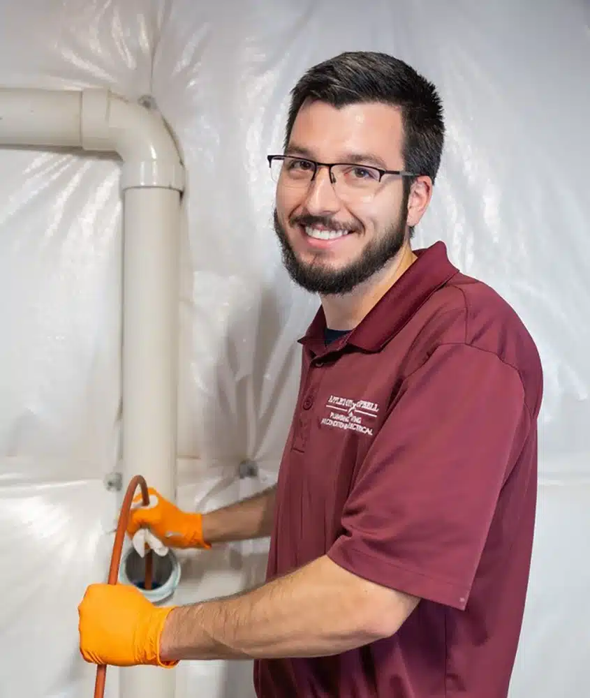 Appleton Campbell technician cleaning drain in Warrenton, VA.