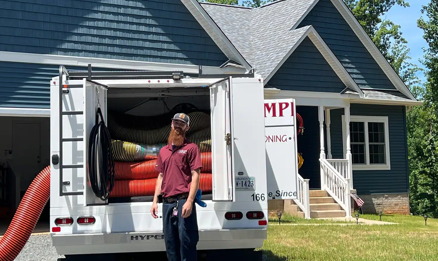 Appleton technician in front of residential home in Warrenton, VA